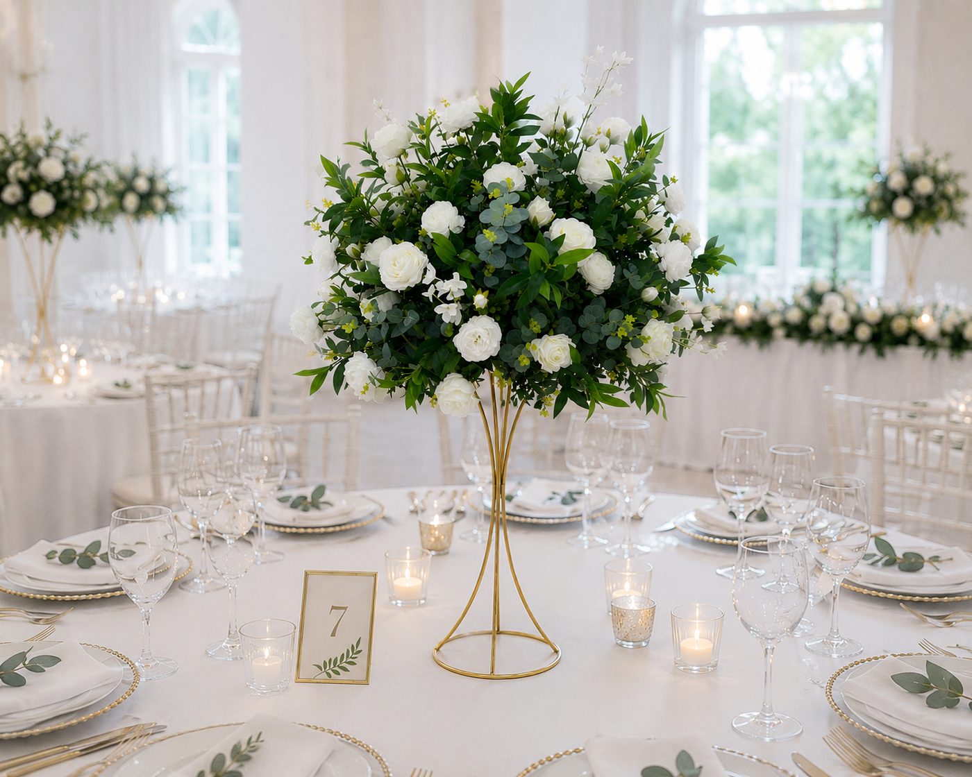 Classic white rose and greenery centrepiece on a gold stand