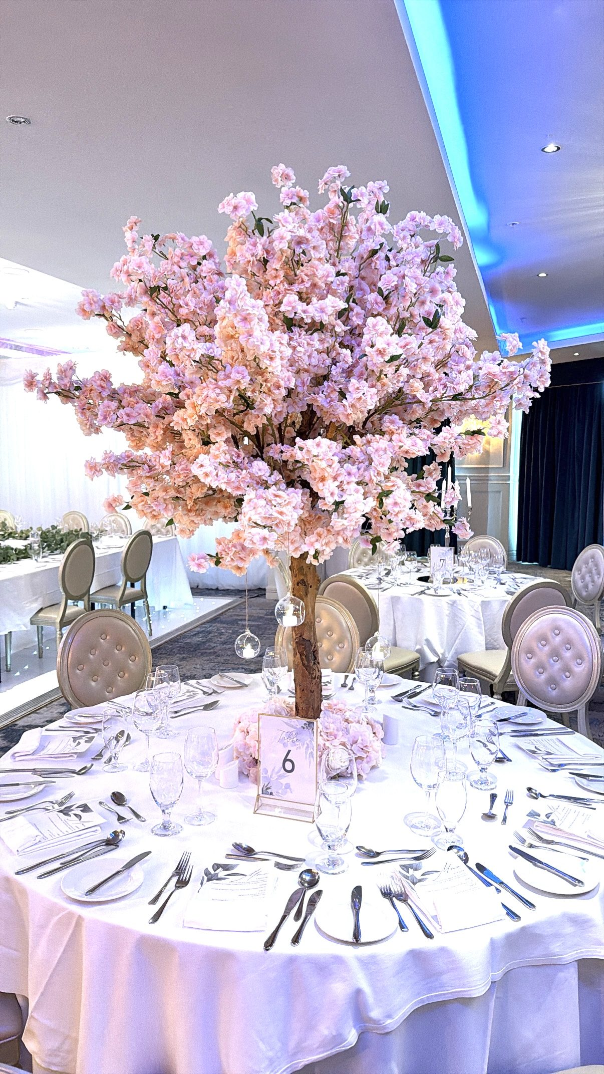 Pink cherry blossom tree as a reception table centrepiece